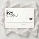 Bon cadeau Inoiv de CHF 100 sur papier de soie blanc