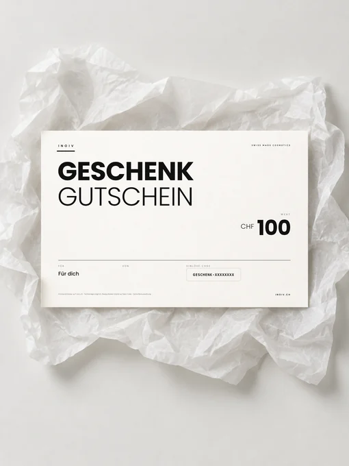 Inoiv Geschenkgutschein über CHF 100 auf weissem Seidenpapier